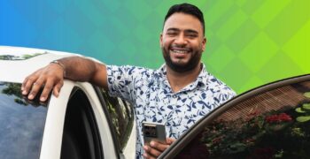 Driver standing by car