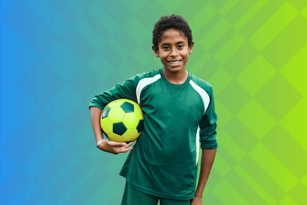 Boy holding soccer ball
